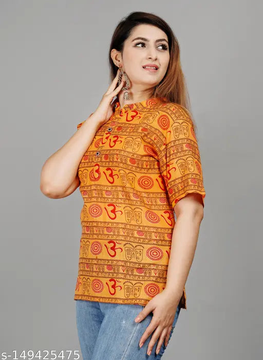 Cotton short-sleeve printed top for women, vibrant pattern on size S (bust 36in, length 30in), made in India