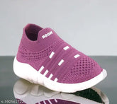 Pink canvas slip-on shoes for baby boys and girls, soft breathable with supportive sole, ideal for night outings