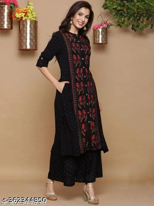 Black rayon printed A-line kurta with palazzo set, three-quarter sleeves, Indian ethnic wear for women. Single size available: M (Bust 38", Shoulder 14", Waist 36", Hip 42", Length 46"), L (Bust 40", Shoulder 14.5", Waist 38", Hip 46", Length 46"), XL (Bust 42", Shoulder 15", Waist 40", Hip 46", Length 46"), XXL (Bust 44", Shoulder 15.5", Waist 42", Hip 50", Length 46")