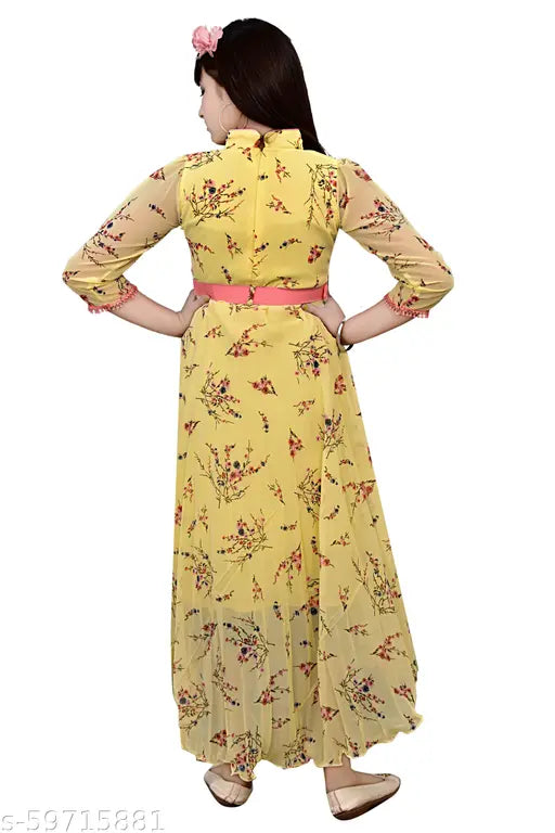 Yellow rayon ethnic gown for girls, printed net, three-quarter sleeves. Sizes: 4-5 years (23in bust, 30in length), India origin