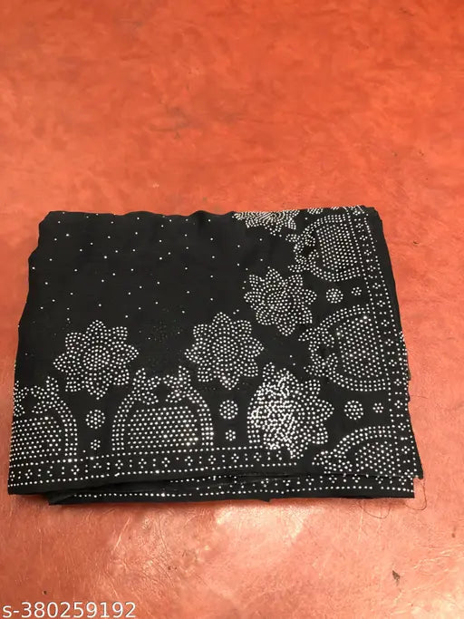 Black Georgette silk saree with heavy diamond work border, contrast blouse included. Embellished net pattern, loved by women. Indian-made, free size (saree length 5.5m, blouse length 0.8m)
