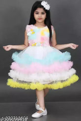 Multicolor net party dress for baby girls, fashionable colorblocked frock on display