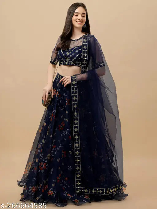 Embroidered floral Art Silk lehenga set with net bottom and dupatta on a display stand, Indian traditional women's clothing