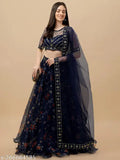 Embroidered floral Art Silk lehenga set with net bottom and dupatta on a display stand, Indian traditional women's clothing
