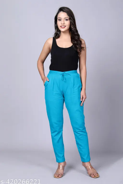 Cotton blend, comfortable daily wear trousers for women in solid color, embellished with elastic side pocket and Rajasthani traditional design