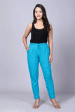 Cotton blend, comfortable daily wear trousers for women in solid color, embellished with elastic side pocket and Rajasthani traditional design