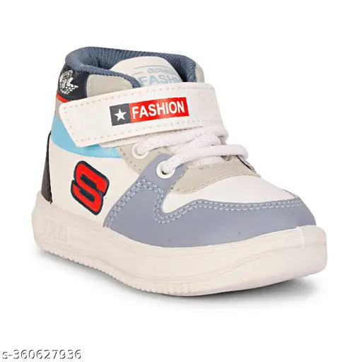Grey synthetic leather Kids Jordans. Colorblocked design, lace-up fastening, ideal for boys. Durable PVC sole shoes from India." (123 characters)