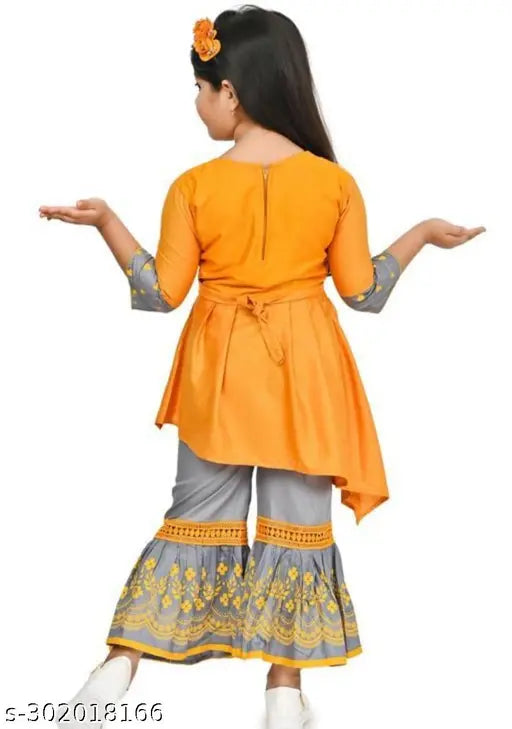 Red cotton kurta set with sharara bottomwear, acrylic dupatta for kids party wear. Designer elegant girls clothing in solid style, floral print on fine rayon fabric