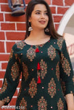 Trendy casual green rayon kurta Sharara set with three-quarter sleeves, printed pattern, available in sizes S-XXL. Indian ethnic wear on mannequin