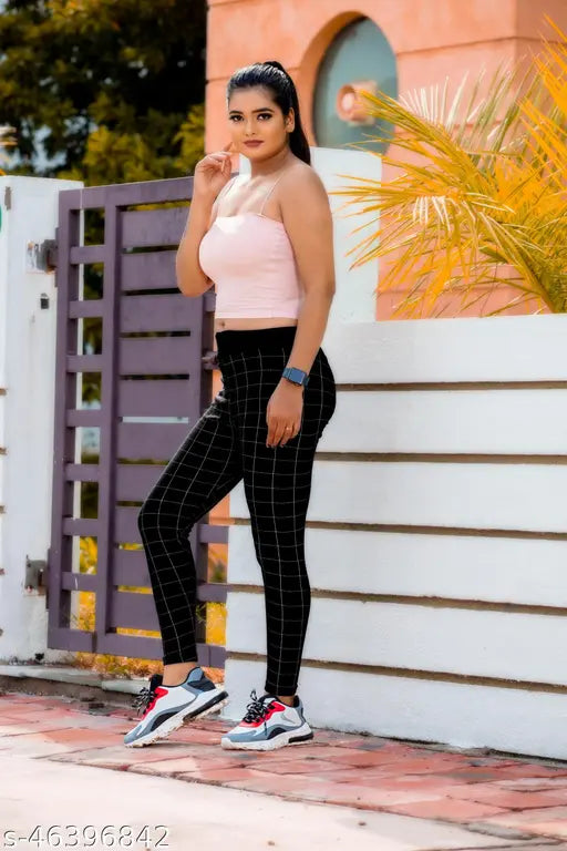 Women's printed net cotton blend slim fit jeggings, size 26-36. Label free design for comfort and ultra-stretch material for flexibility. Elasticized waistband and pockets included. Versatile fashionwear suitable for casual, formal, or party wear. Made in India