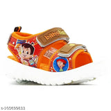 Tan orange and green patent leather chota Bahubali kids sandals for summer wear, ideal for boys aged 2-3 years. Velcro fastening, cartoon character pattern." (124 characters)