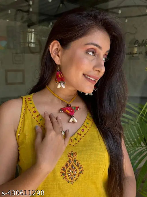 Sleeveless cotton-linen kurta set with embroidered palazzo pants, perfect for office wear