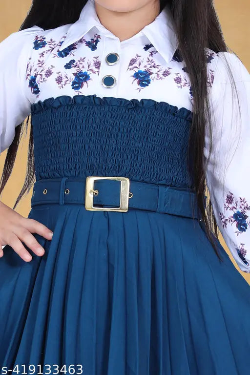 Blue crepe knee-length party dress for kids, printed with cute motifs, three-quarter sleeves. Sizes: 5-6 (26in), 6-7 (28in), 7-8 (30in), 8-9 (32in), 9-10 (34in), 10-11 (38in), 11-12 (38in). Made in India