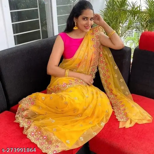 Super Net embroidered sari with separate dupion silk blouse, featuring cutwork brodery on pallu and multithread embellishments with real mirror work. Available in mustard yellow, off white, black, sky blue, and steel gray. Saree length: 5.5m, blouse length: 0.8m. Origin: India