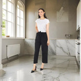 White crepe jumpsuit with black dot print by Pearl N Vera, suitable for casual or semi-formal events. High-quality crepe fabric offers comfort and durability. Sizes: S (Bust 32", Length 52", Waist 28"), M (Bust 34", Length 53", Waist 30"), L (Bust 36", Length 54", Waist 32"), XL (Bust 38", Length 55", Waist 34"), Free Size (Bust 37", Length 55", Waist 34"). Machine wash gentle or hand wash, do not bleach. Country of Origin: India