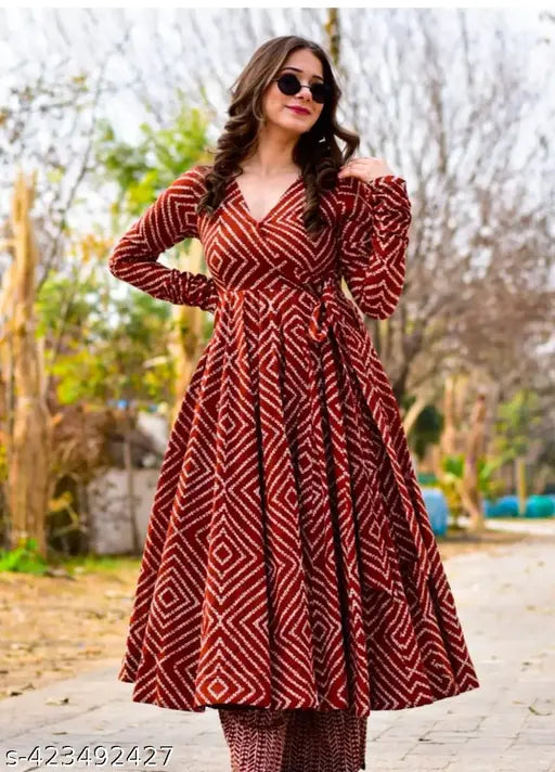 Maroon rayon Anarkali lining gown with pant kurta, three-quarter sleeves, printed net, and palazzos bottom – Indian fashion on display stand