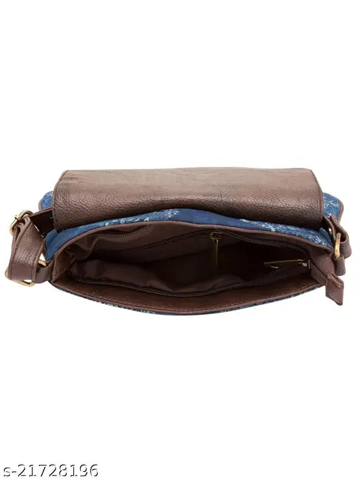 Faux leather indigo sling bag with tassel detail, printed net pattern, single compartment. Made in India." (98 characters)