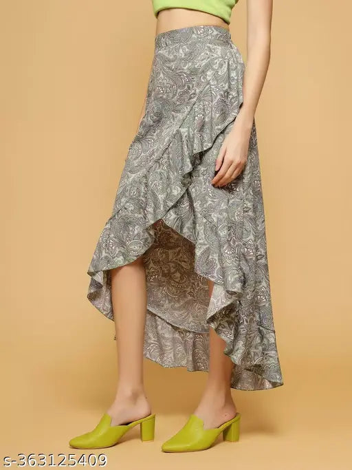 Grey crepe printed net A-line skirt for women by OOMPH, featuring high low wrap style with ruffles on hem and elastic waist. Made in India." (109 characters)