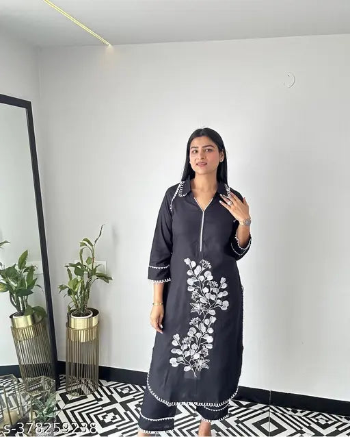 Rayon floral embroidered A-line kurta with palazzos, solid green, three-quarter sleeves, India origin