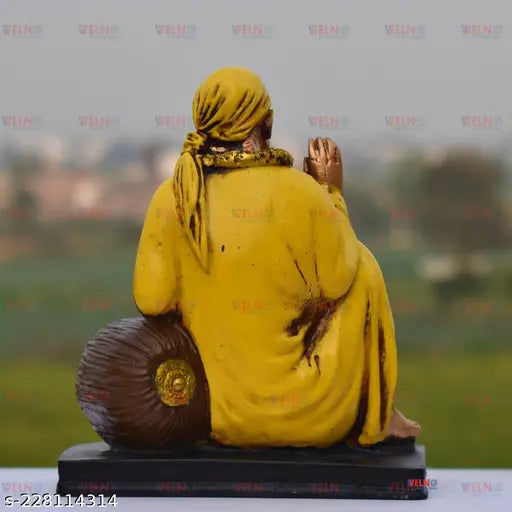 Yellow resin Sai Baba Idol for home decor or office Vastu, 17 cm tall