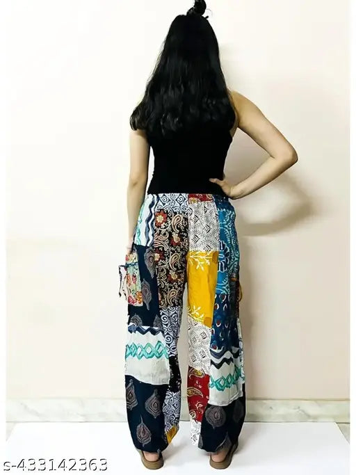 Multi-colored cotton harem pants for men and women, featuring a loose fit, elastic waist, patchwork design, and unique printed net pattern - Indian made