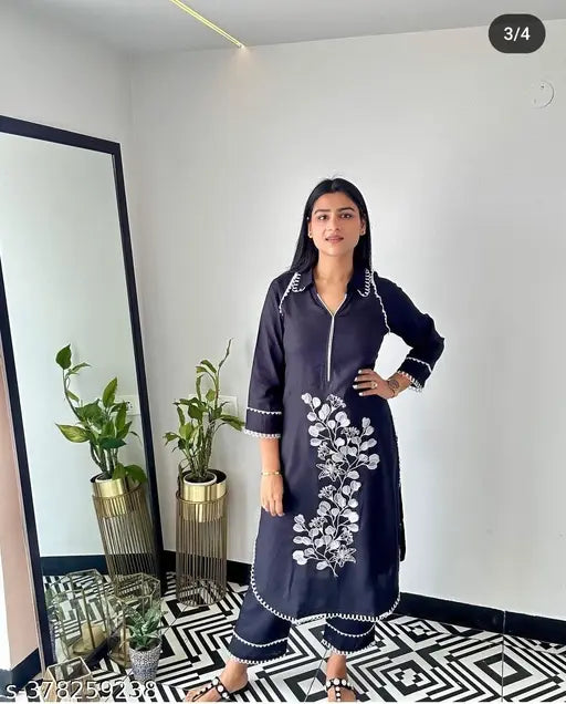 Rayon floral embroidered A-line kurta, three-quarter sleeves set in green on palazzos, India-made fashion for women