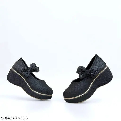 Synthetic leather, polyurethane wedges. Stylish kids' black woven shoes with gold trim and bow detail. Comfortable for 5-9 year olds, perfect for young fashionistas