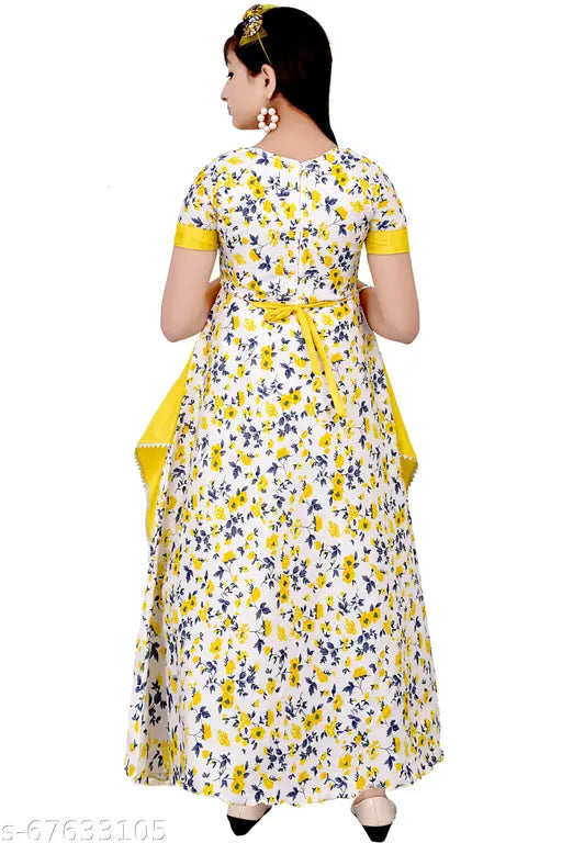 Printed cotton blend ethnic gown for girls, vibrant in light green, red, and light yellow. Little princess outfit on display stand