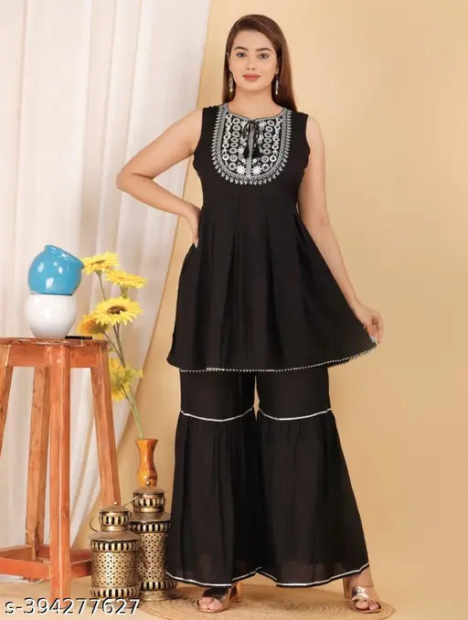 Black rayon kurta set with sharara and dupatta: Women's A-line sleeveless kurti, sharara, and dupatta made for various occasions, crafted from lightweight, soft rayon fabric