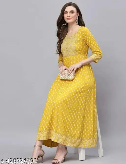 Yellow printed Anarkali gown with embroidery, rayon, three-quarter sleeves. Stylish Indian women's festival wear for sizes S to XXXL. Mirror work detailing on festive occasion dresses