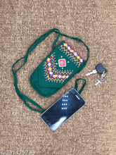Green embroidered net sling bag, high-quality mirror works, eco-friendly women's mobile side bag. Perfect for travel, vacations, or everyday use
