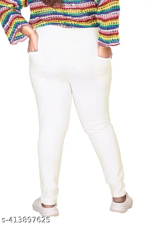 Plus-size women's white denim jeggings with stretchable Lycra fabric, high rise and skinny fit. Premium quality, elastic band in waist for comfort. Available sizes: 5XL - 10XL (42" - 52"). Made in India