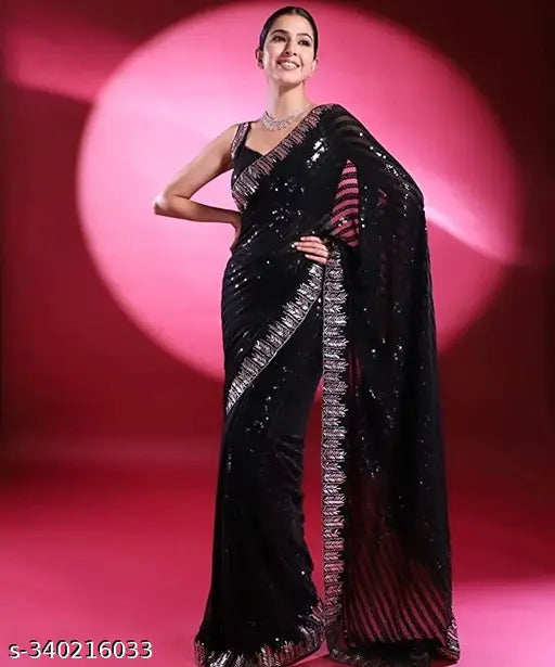 Black Georgette saree with all-over sequins and silver border, embellished net blouse