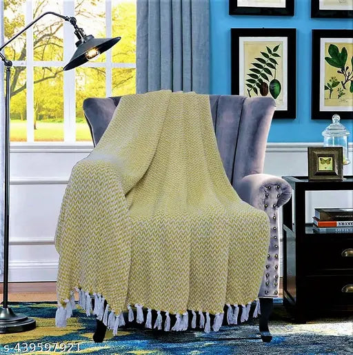Abstract cotton chevron throw, vibrant pattern on a queen-sized bed