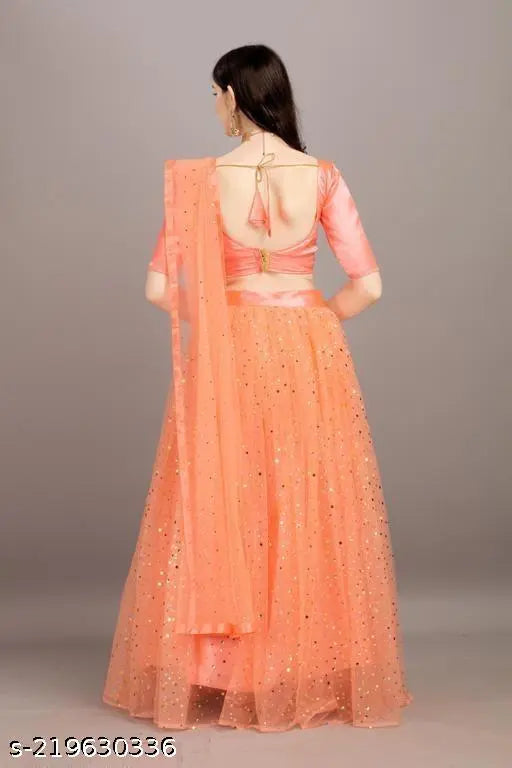 Golden satin lehenga with embellished net dupatta, semi-stitched, Indian wedding wear on mannequin