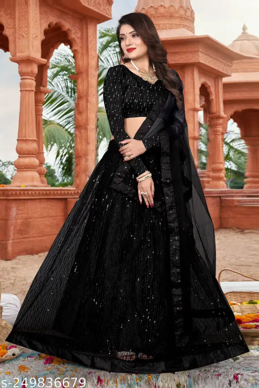 Black net embroidered Lehenga Choli set with blouse and dupatta, featuring intricate work on a semi-stitched design. Perfect for traditional occasions like weddings or festivals. Indian ethnic wear