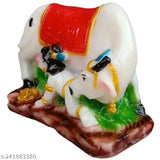 Marble-look Kamdhenu cow and Lord Krishna idol, poly resin religious decor for home or temple. Divine cow showpiece with milking Krishna figure. Indian origin