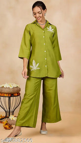 WineRed woman solid green leaf embroidery co-ord set with short sleeves, polyester fabric, 3/4th sleeve with placement embroidery, self tie-up, pant with one pocket, elasticated waistband, slip on closure. Made in India