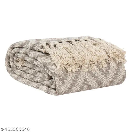 Grey reversible quilt Ikkat sofa blanket cover for 3-seater couch, size 50 x 60 inches, ideal for AC rooms