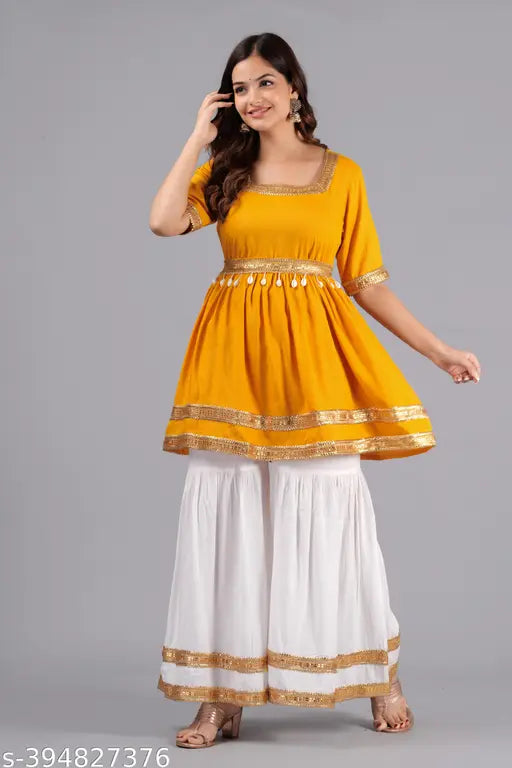 Yellow rayon sharara set with belt and neckless, featuring short sleeves and a square neckline, adorned with floral print. Made in India