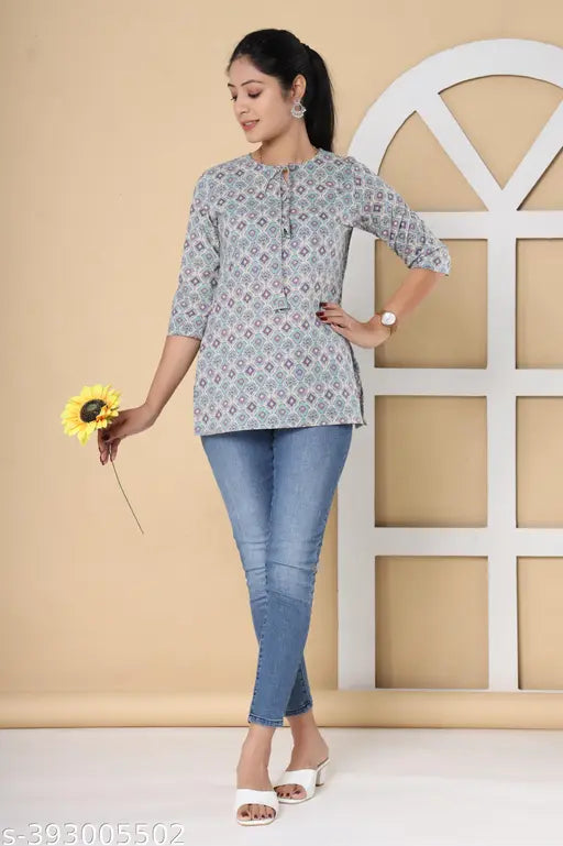 Grey cotton women's top with ethnic motifs, three-quarter sleeves, printed net pattern. Made in India." (106 characters)