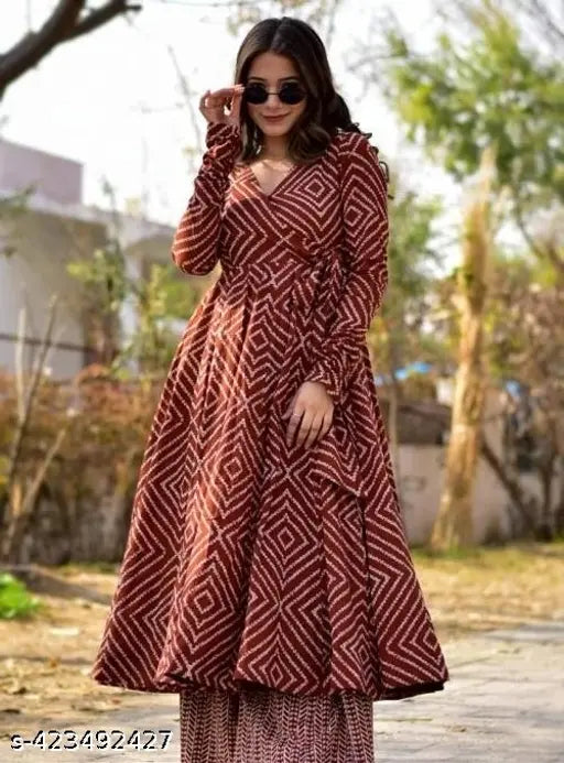 Maroon rayon anarkali gown with pant kurta and palazzos, printed net, three-quarter sleeves, fashionable Indian women's outfit on mannequin