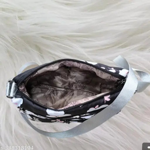 Floral multi-pocket polyester crossbody purse bag, lightweight and versatile for travel or daily use. Features 3 compartments, adjustable shoulder strap, and padded interior. Ideal for women, girls, or as a gift. Made in India