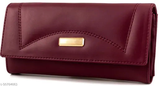 Maroon faux-leather clutch purse with magnetic closure, 5 compartments, zipper pockets, and trending design