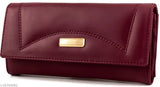 Maroon faux-leather clutch purse with magnetic closure, 5 compartments, zipper pockets, and trending design