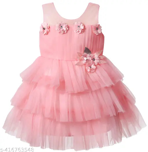White net sleeveless knee-length party dress for baby girls, embellished design on display