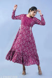 Gorgeous rayon wine-tiered gown with long sleeves and printed pattern, perfect for special events