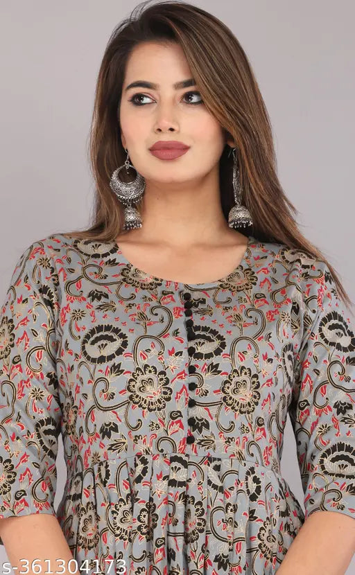 Rayon printed women's kurti, three-quarter sleeves, stylish design for daily wear in vibrant colors and patterns. Indian-made fashion statement
