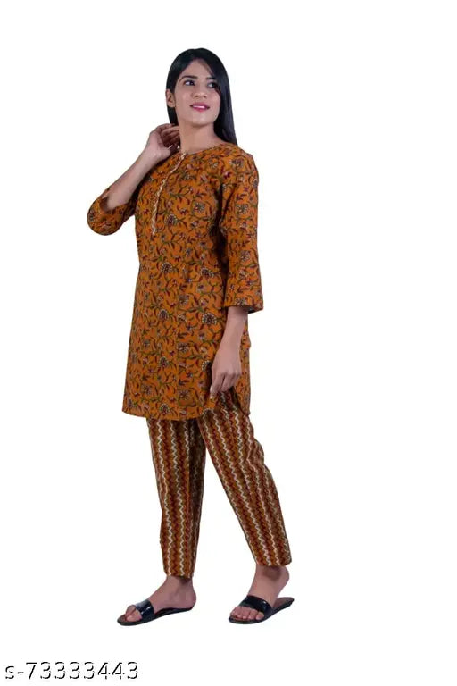 Mustard yellow cotton botanical printed women's pyjama set & mask, featuring elastic waist & drawstrings. Soft, breathable comfort for dreamy nights. Made in India