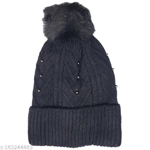 Black wool beanie hat with soft pom pom, warm for winter weather